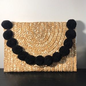 Francesca’s Accessories, Straw and Black Pom Clutch